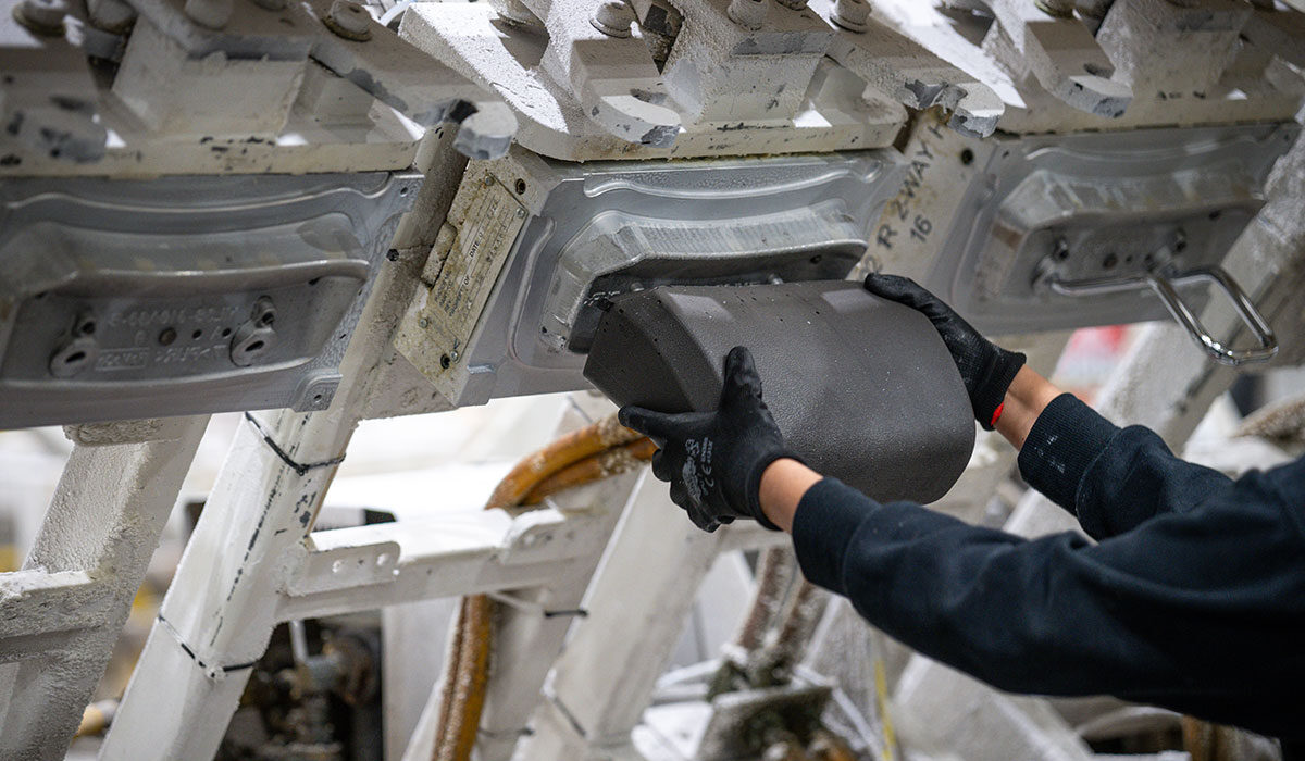 employee with hands on headrest