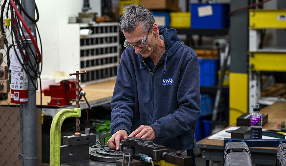 WMG employee in WMG branded sweater