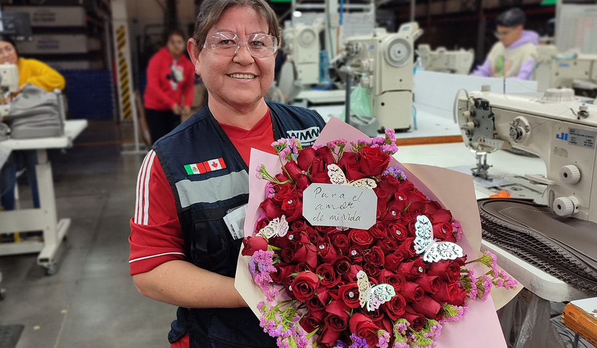 employee at WMM with flowers