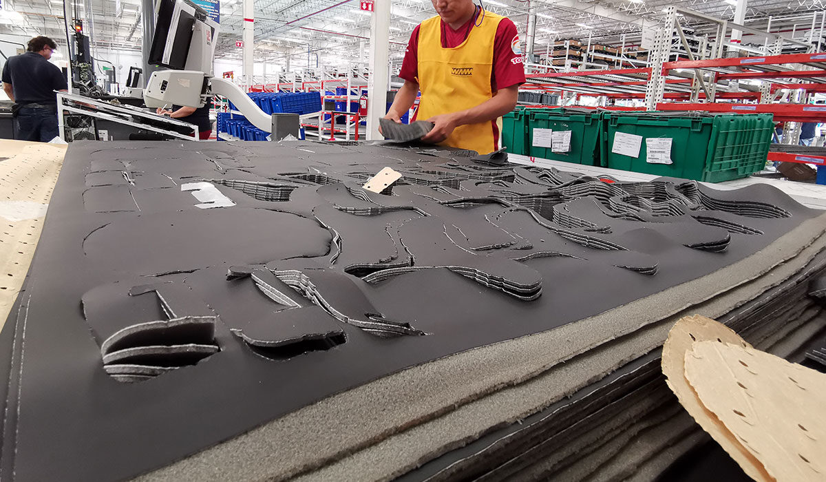 employee working with trim