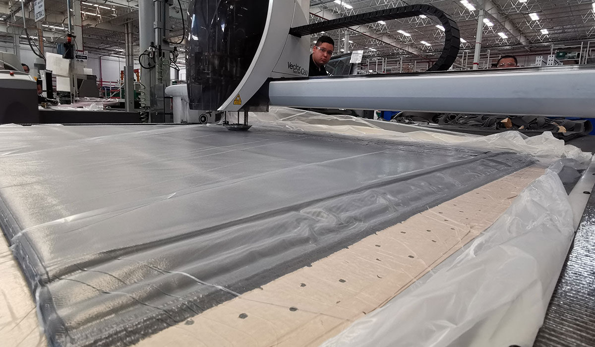 employee working on trim equipment