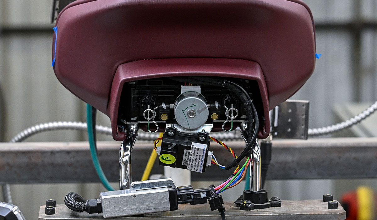 burgundy headrest being tested for quality